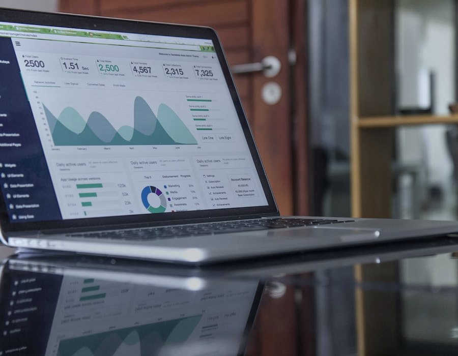 Laptop screen showing charts, totals and graphs for data analysis